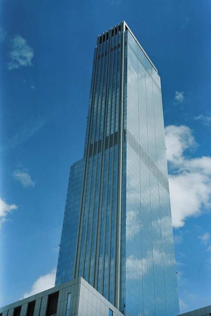 pexels-photo-30216355-30216355 A striking modern skyscraper in Astana, Kazakhstan, set against a clear blue sky.